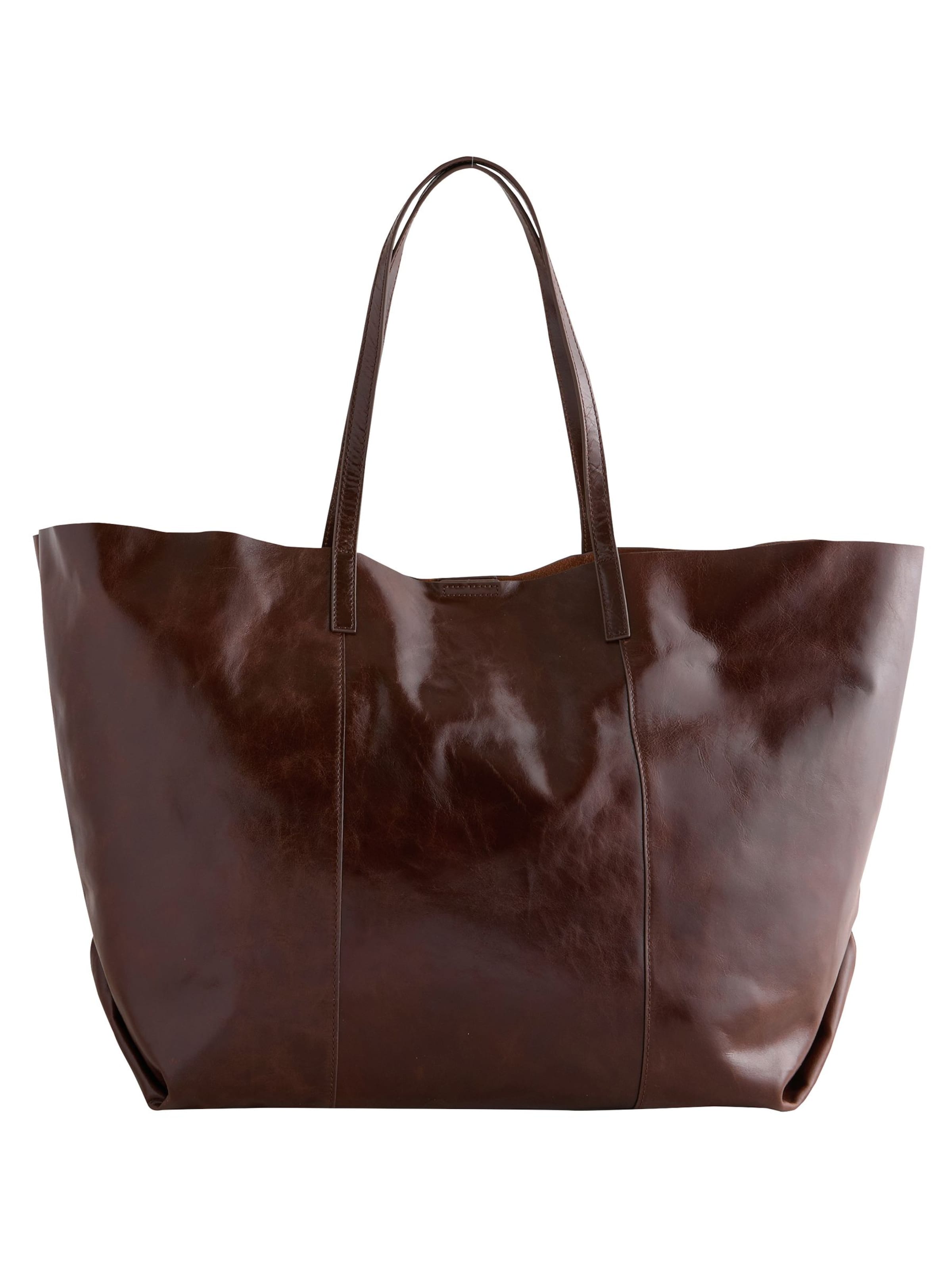 Next Shopper in Bruin: voorkant