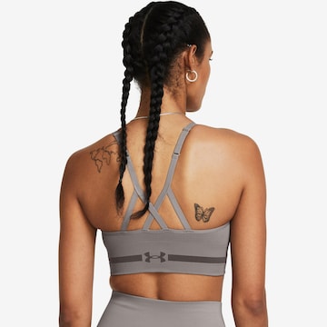 UNDER ARMOUR - Soutien Bustier Soutien de desporto em cinzento