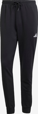 ADIDAS SPORTSWEAR Tapered Sports trousers 'FEELCOZY' in Black: front