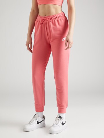 Nike Sportswear Tapered Pants in Orange: front