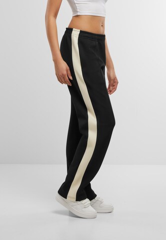 Loosefit Pantaloni con piega frontale di Karl Kani in nero
