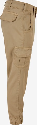 Tapered Pantaloni di Urban Classics in beige