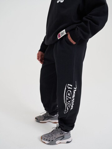 AND1 Tapered Funktionsbyxa i svart