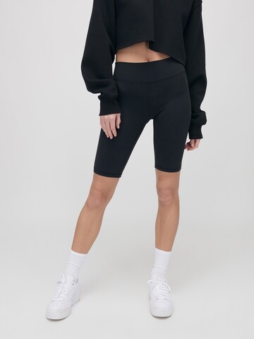 ABOUT YOU x VIAM Studio Skinny Trousers 'TAYLOR' in Black: front