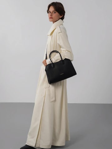 Borsa a mano 'Lancaster Sac à main Zippé M Donna Hopper Noir' di LANCASTER Paris in nero