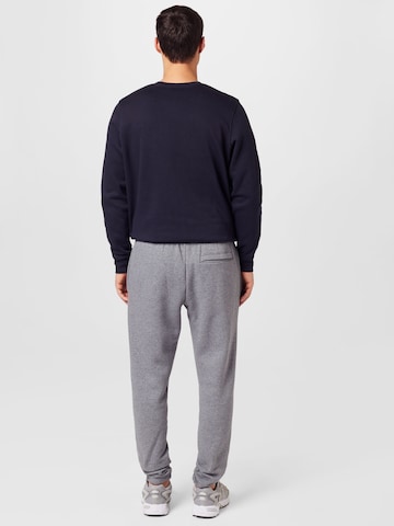 UNDER ARMOUR Tapered Sporthose 'Essential' in Grau