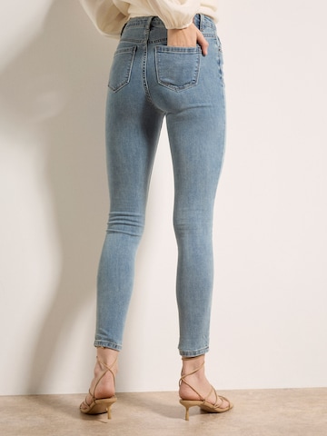 Skinny Jean Apricot en vert