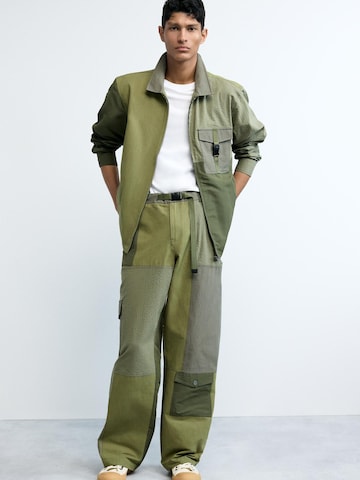 Desigual Zvonové kalhoty Kapsáče – zelená