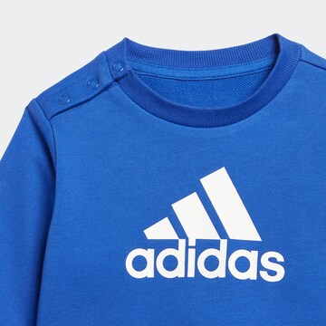 ADIDAS SPORTSWEAR Skinny Tracksuit 'Badge Of Sport French Terry' in Blue