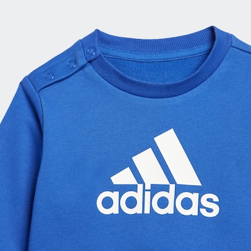 ADIDAS SPORTSWEAR Skinny Treenipuku 'Badge Of Sport French Terry' värissä sininen