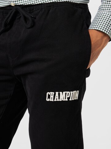 Champion Authentic Athletic Apparel Tapered Housut värissä musta