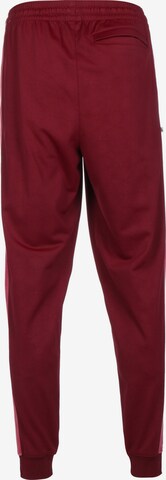 Tapered Pantaloni sportivi 'Giannis' di NIKE in rosso