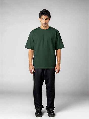 UNORGANIZED BRAND T-shirt 'SCHWERES COMFORT T15' i grön
