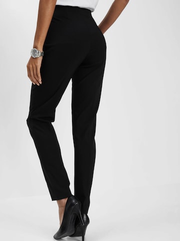 bonprix Skinny Nadrág - fekete