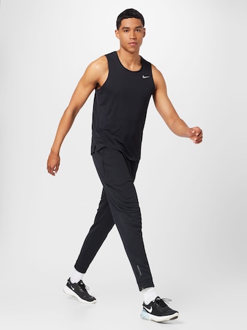 NIKE Sporttop 'Miler' in Schwarz