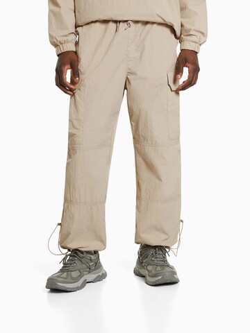 Effilé Pantalon cargo Bershka en beige : devant