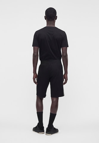 EA7 Emporio Armani - regular Pantalón en negro: atrás