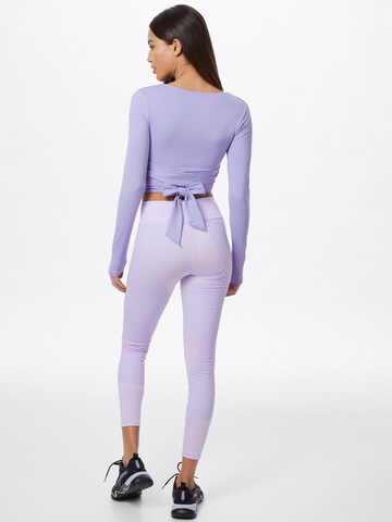 PUMA - Skinny Calças de desporto 'Studio Porcelain' em roxo