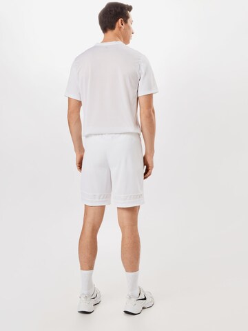 Regular Pantalon de sport 'Academy' NIKE en blanc
