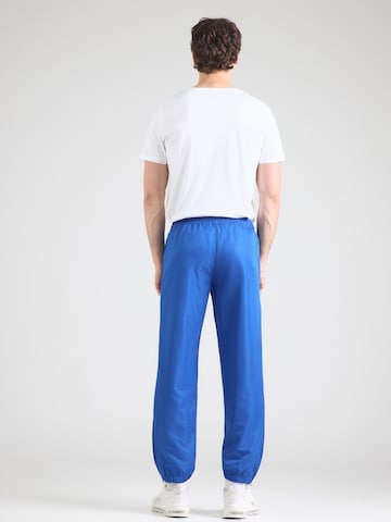 Sergio Tacchini Zwężany krój Spodnie sportowe 'Carson 021' w kolorze niebieski