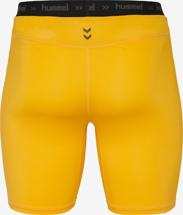 Hummel - Skinny Pantalón deportivo en amarillo