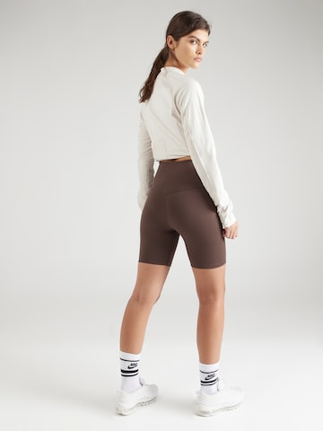 NIKE Skinny Sportbroek 'ONE' in Bruin
