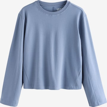 Next T-shirt i blå: framsida