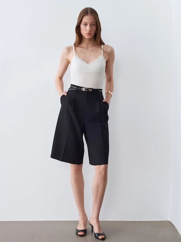 Top di Dilvin in bianco