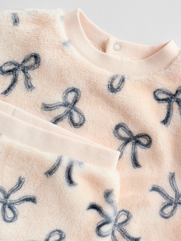 Set Next en rose