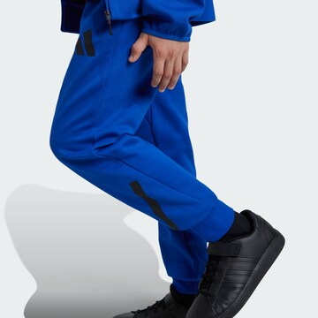 ADIDAS SPORTSWEAR Tapered Sports trousers in Blue