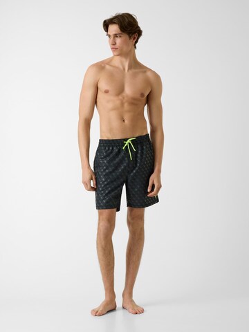 GUESS Badeshorts in Schwarz