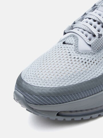 NIKE Juoksukengät 'Pegasus Premium' värissä harmaa