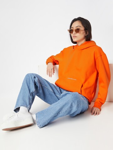 Sweat-shirt 'Institutional' Calvin Klein Jeans en orange