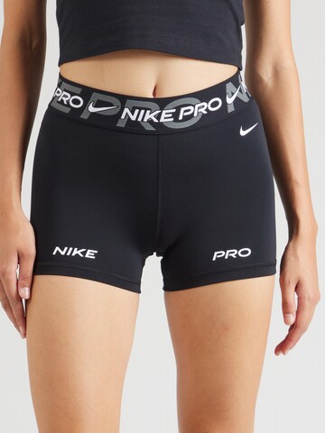 NIKE - Skinny Pantalón deportivo en negro: frente