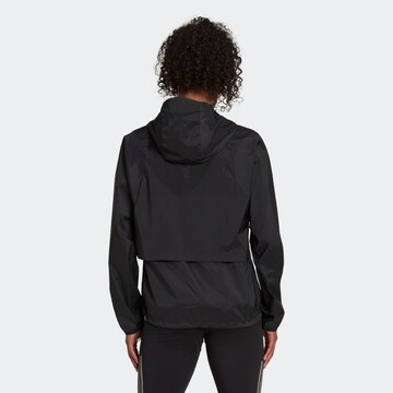 ADIDAS SPORTSWEAR Ulkoilutakki 'Run Fast Zip Solid' värissä musta