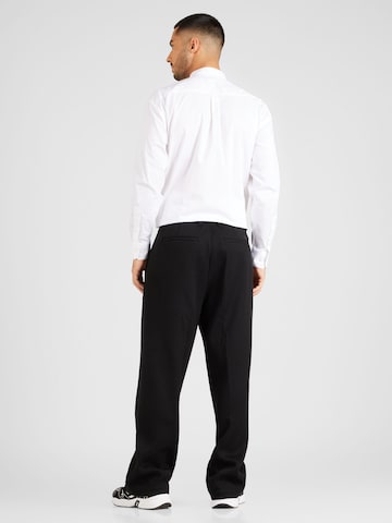 Calvin Klein - Pierna ancha Pantalón plisado en negro