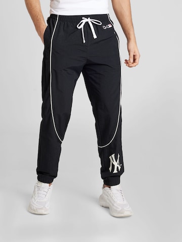 Champion Authentic Athletic Apparel Tapered Nadrág - fekete: elől