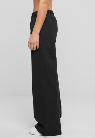 Wide leg Pantaloni di Karl Kani in nero