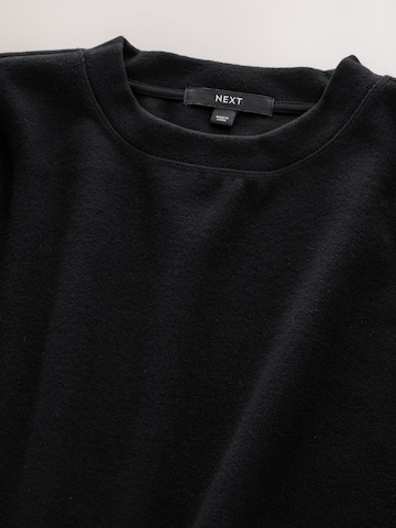 Next Mekko värissä musta