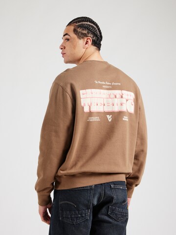 Carhartt WIPSweater majica 'Greatest Flicks' - smeđa boja: prednji dio