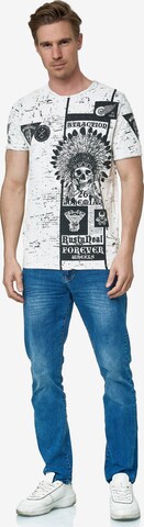 Rusty Neal T-Shirt mit Oil Washed Skull All Over Front Print in Grau