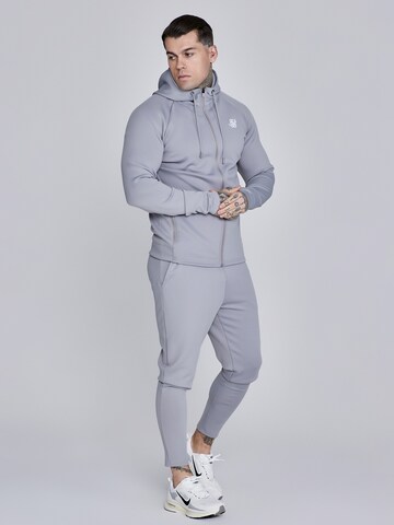 Veste de survêtement 'Poly' SikSilk en gris