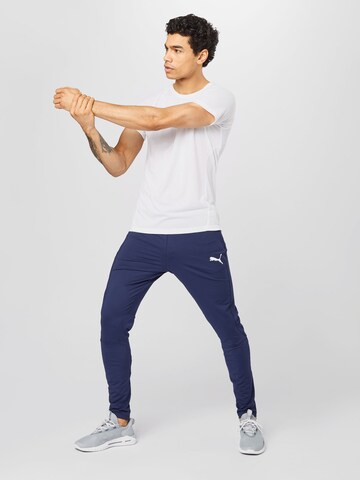 PUMA Slimfit Spodnie sportowe w kolorze niebieski