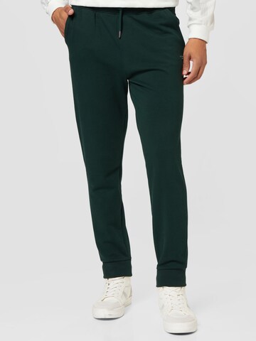 GUESS Kalhoty 'ADAM' – zelená: přední strana