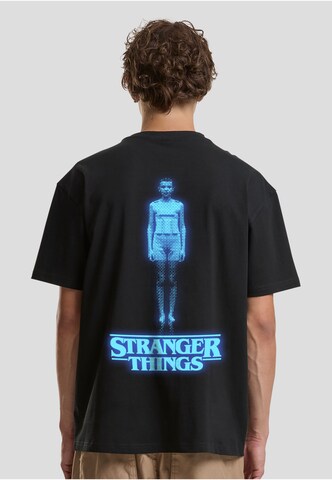 T-Shirt 'Stranger Things Eleven' Merchcode en noir : devant