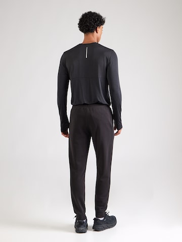 PUMA Tapered Urheiluhousut 'ESS No. 1' värissä musta