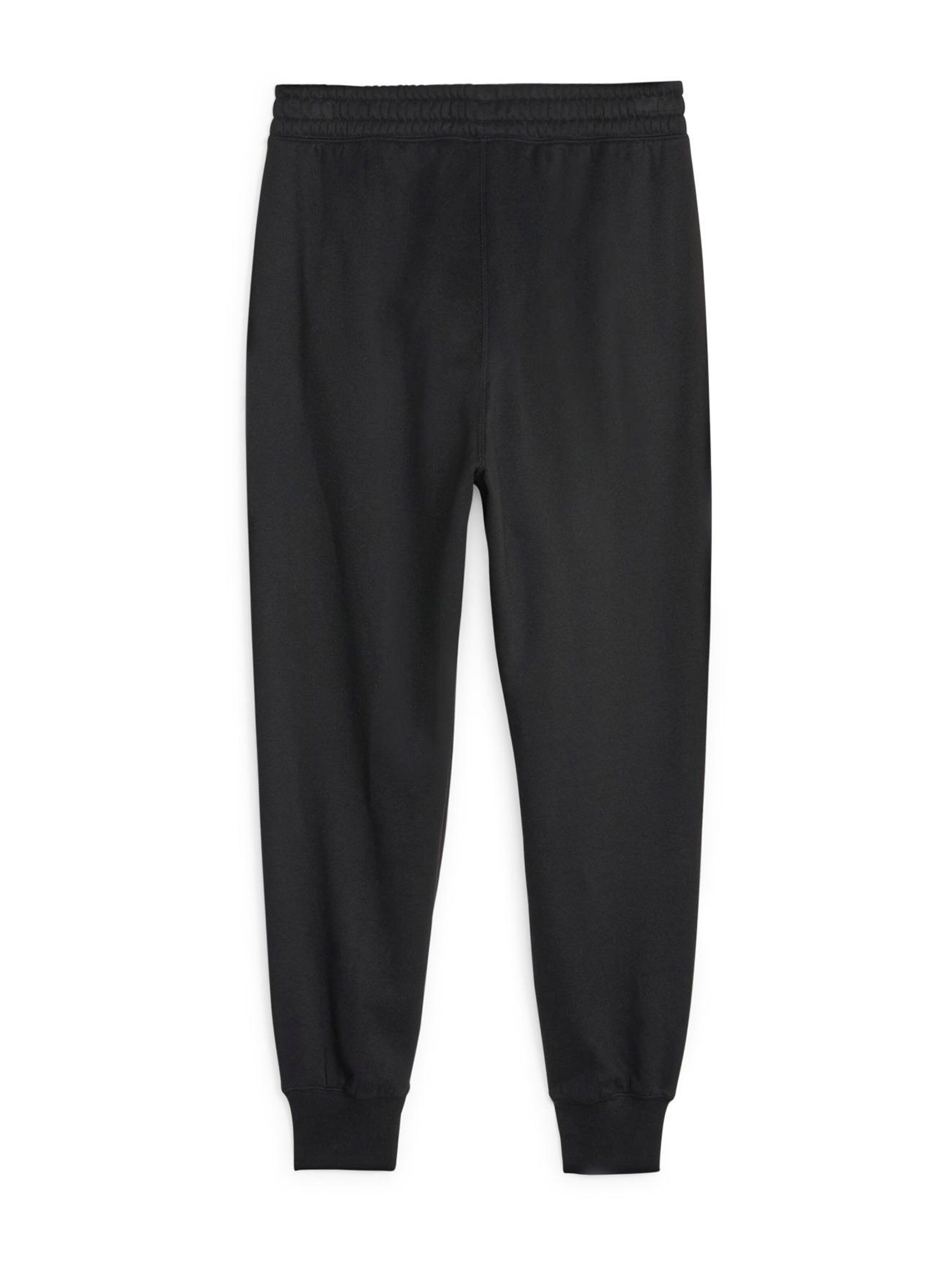 PUMA Tapered Urheiluhousut 'Train Favorite' värissä musta