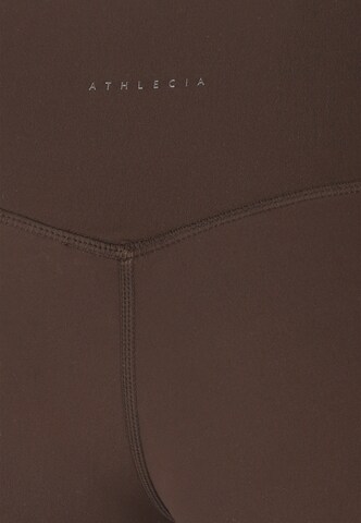 Athlecia Skinny Sportbroek 'Emarri' in Bruin