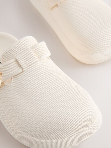 Sandale de la Next pe bej