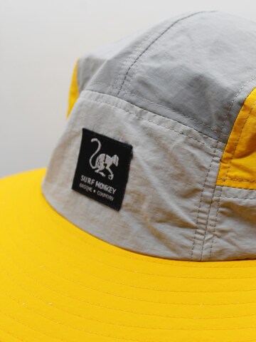 Cappello sportivo di Surf Monkey in giallo